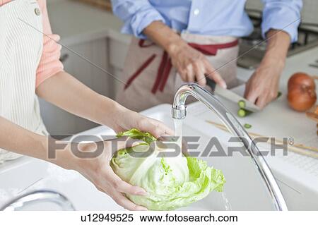 Young couple at kitchen View Large Photo Image Stock Photography - Young couple at kitchen . Fotosearch