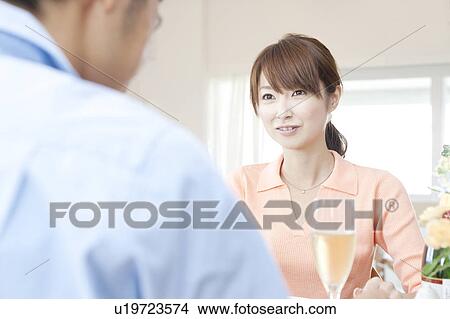 Young couple eating dinner View Large Photo Image Picture - Young couple eating dinner. Fotosearch