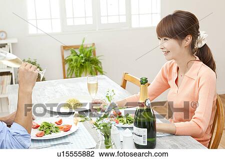 Young couple eating dinner View Large Photo Image Stock Image - Young couple eating dinner. Fotosearch