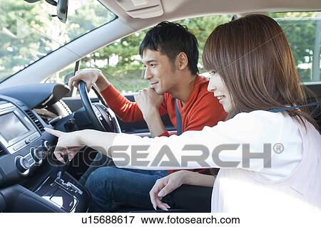 Young couple in a car View Large Photo Image Stock Photo - Young couple in a car. Fotosearch