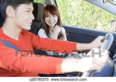 Young couple in a car View Large Photo Image Stock Photography - Young couple in a car. Fotosearch