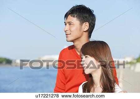 Young couple looking away, Hyogo Prefecture, Honshu, Japan View Large Photo Image Stock Photo - Young couple looking away, Hyogo Prefecture, Honshu, Japan. Fotosearch