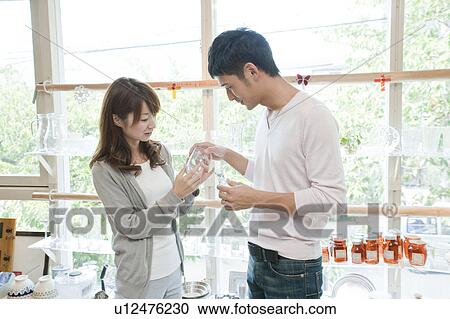 Young couple shopping View Large Photo Image Stock Image - Young couple shopping. Fotosearch
