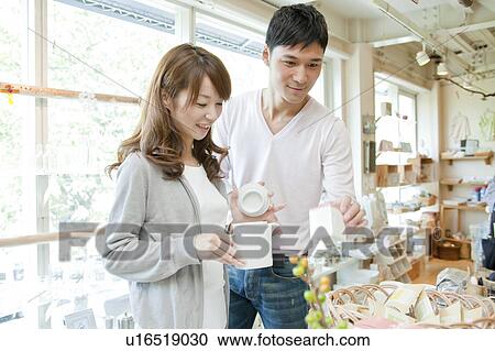 Young couple shopping View Large Photo Image Stock Image - Young couple shopping. Fotosearch