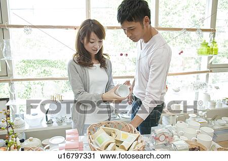 Stock Image - Young couple shopping. Fotosearch