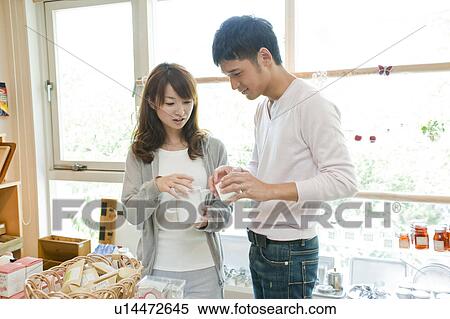 Young couple shopping View Large Photo Image Stock Photography - Young couple shopping. Fotosearch