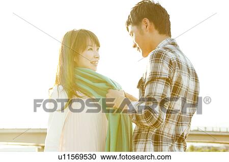 Young couple standing face to face, Hyogo Prefecture, Honshu, Japan View Large Photo Image Stock Image - Young couple standing face to face, Hyogo Prefecture, Honshu, Japan. Fotosearch