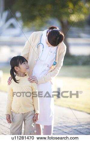 Young Female Nurse and Girl View Large Photo Image Stock Image - Young Female Nurse and Girl. Fotosearch