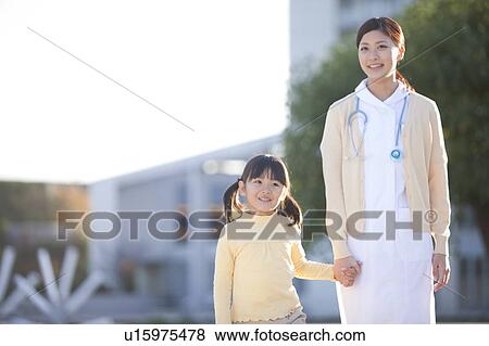 Young Female Nurse and Girl View Large Photo Image Stock Photo - Young Female Nurse and Girl. Fotosearch