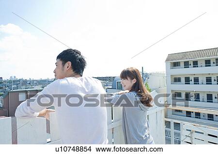 Picture - Young Woman and Man in Balcony. Fotosearch
