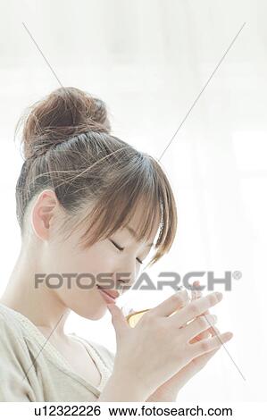 Stock Photograph - Young Woman Having Tea. Fotosearch