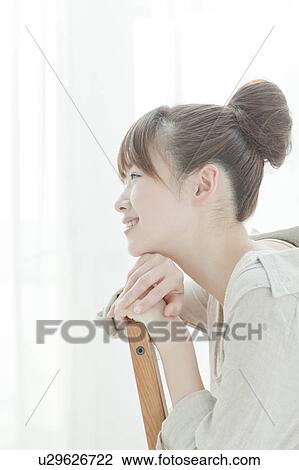 Young Woman Sitting on Chair View Large Photo Image Stock Image - Young Woman Sitting on Chair. Fotosearch
