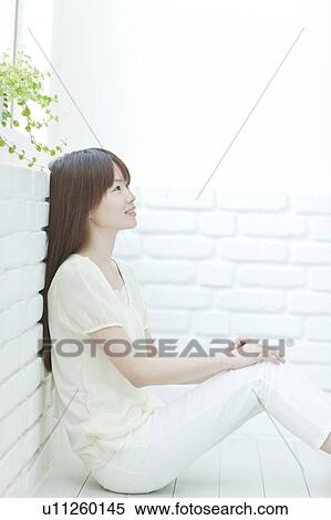 Young woman Sitting on Floor View Large Photo Image Stock Photography - Young woman Sitting on Floor. Fotosearch