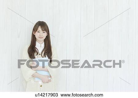 Young woman standing View Large Photo Image Stock Image - Young woman standing. Fotosearch