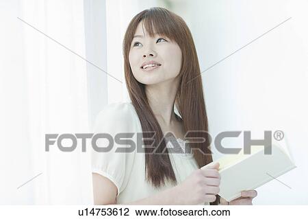 Young Woman with Book View Large Photo Image Stock Image - Young Woman with Book. Fotosearch