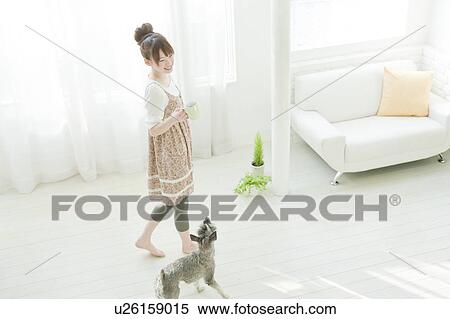Stock Photography - Young Woman with Miniature Schnauzer. Fotosearch