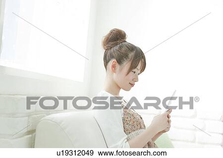 Young Woman with Mobile Phone View Large Photo Image Stock Photo - Young Woman with Mobile Phone. Fotosearch