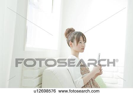Young Woman with Mobile Phone View Large Photo Image Stock Photograph - Young Woman with Mobile Phone. Fotosearch