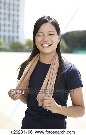 Stock Photograph - Young Woman with Towel Around Her Neck. Fotosearch