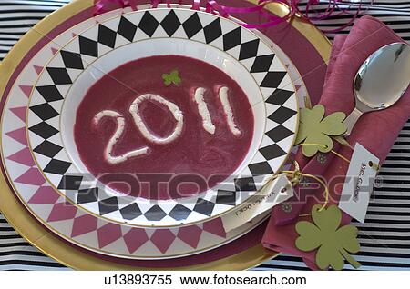 Stock Photography - 2011 written in soup plate. Fotosearch