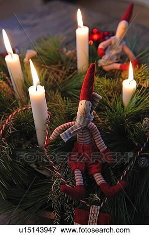 Stock Photo - Advent wreath with burning candles. Fotosearch
