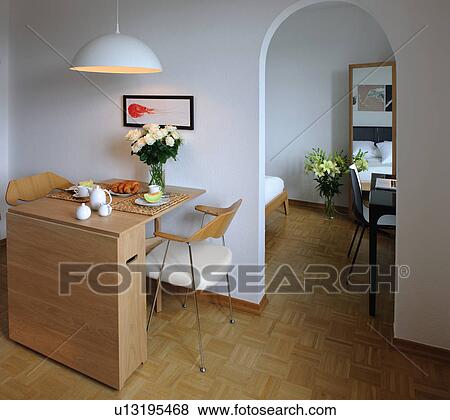 Apartment with dining room and passageway to bedroom View Large Photo Image Stock Photo - Apartment with dining room and passageway to bedroom. Fotosearch