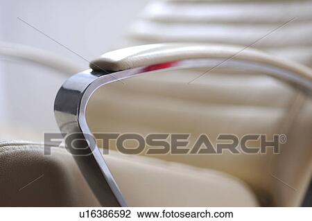 Stock Image - Armchair with chromium and white leather. Fotosearch