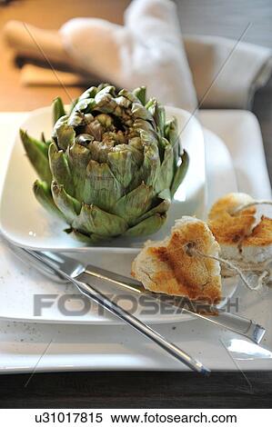 Artichoke and bread on plate View Large Photo Image Stock Photography - Artichoke and bread on plate. Fotosearch