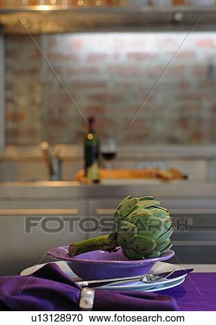 Artichoke on plate in kitchen View Large Photo Image Stock Image - Artichoke on plate in kitchen. Fotosearch