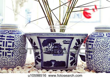 Stock Photograph - Asian receptacles and houseplant. Fotosearch
