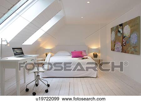 Attic flat with bed and working area View Large Photo Image Stock Photo - Attic flat with bed and working area. Fotosearch