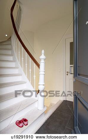 Stock Image - Baby shoes on staircase. Fotosearch