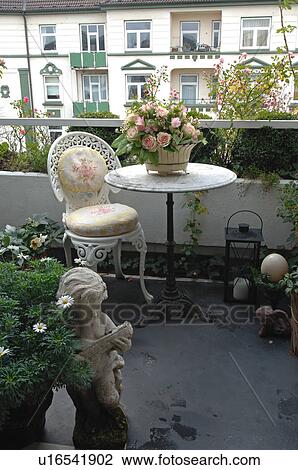 Balcony With Table Chair And Flower Arrangements Stock Image Chair And Flower Arrangements