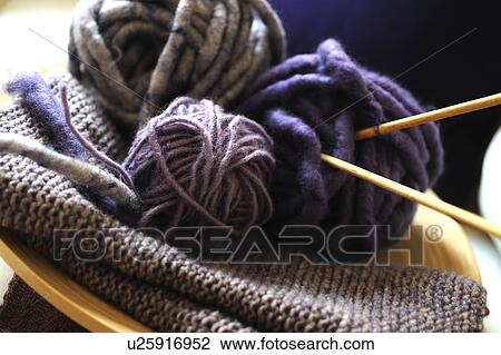 Stock Image - Balls of wool and knitting needles. Fotosearch