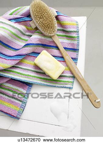 Bar of soap and back brush on striped towel View Large Photo Image Stock Image - Bar of soap and back brush on striped towel. Fotosearch
