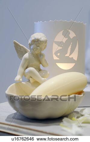 Bar of soap in bowl with small angel figurine View Large Photo Image Stock Photograph - Bar of soap in bowl with small angel figurine. Fotosearch