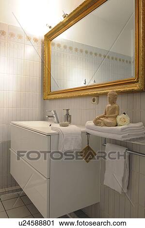 Bathroom with mirror and statue of Buddha View Large Photo Image Stock Image - Bathroom with mirror and statue of Buddha. Fotosearch