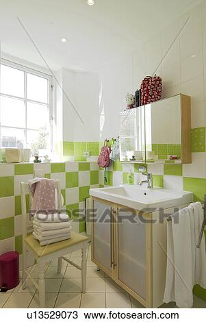 Bathroom with sink, mirror and towels on chair View Large Photo Image Stock Image - Bathroom with sink, mirror and towels on chair. Fotosearch
