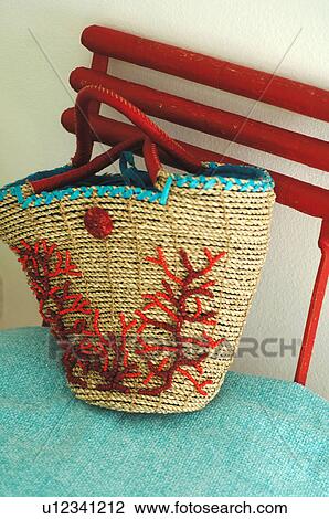 Stock Image - Beach bag on chair. Fotosearch