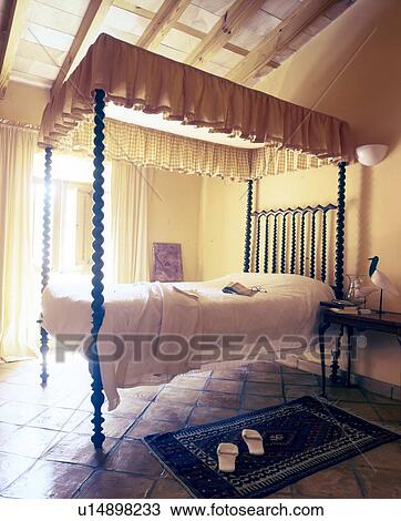 Stock Image - Bed with baldachin. Fotosearch