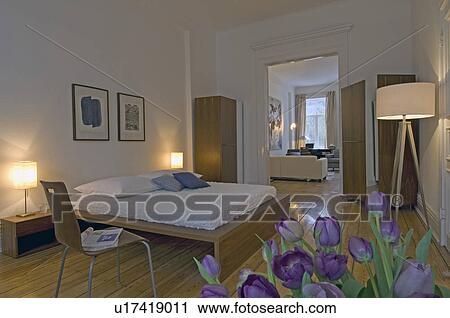 Stock Image - Bedroom with bright wooden furniture. Fotosearch