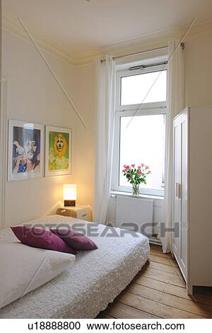 Bedroom with paintings on the wall View Large Photo Image Stock Image - Bedroom with paintings on the wall. Fotosearch