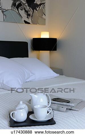 Bedroom with tray on bed View Large Photo Image Stock Photo - Bedroom with tray on bed. Fotosearch