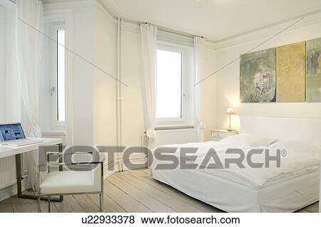 Stock Photo - Bedroom with working area. Fotosearch