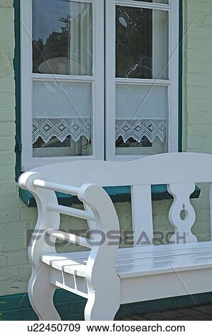 Stock Photo - Bench at the window of a residential building. Fotosearch