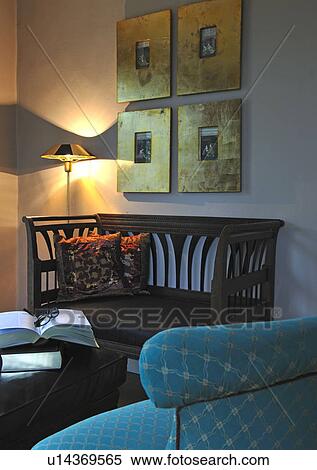 Bench, floor lamp, book and pictures on the wall View Large Photo Image Stock Photography - Bench, floor lamp, book and pictures on the wall. Fotosearch