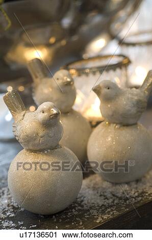 Bird figurines on artificial eggs View Large Photo Image Stock Image - Bird figurines on artificial eggs. Fotosearch