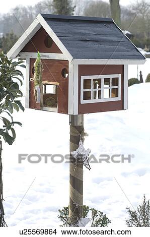 Picture - Birdhouse in snow. Fotosearch