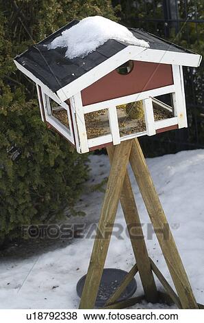 Birdhouse in snow View Large Photo Image Stock Photo - Birdhouse in snow. Fotosearch