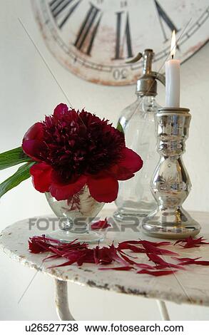 Blossom, candle and soda dispenser on table View Large Photo Image Stock Photo - Blossom, candle and soda dispenser on table. Fotosearch